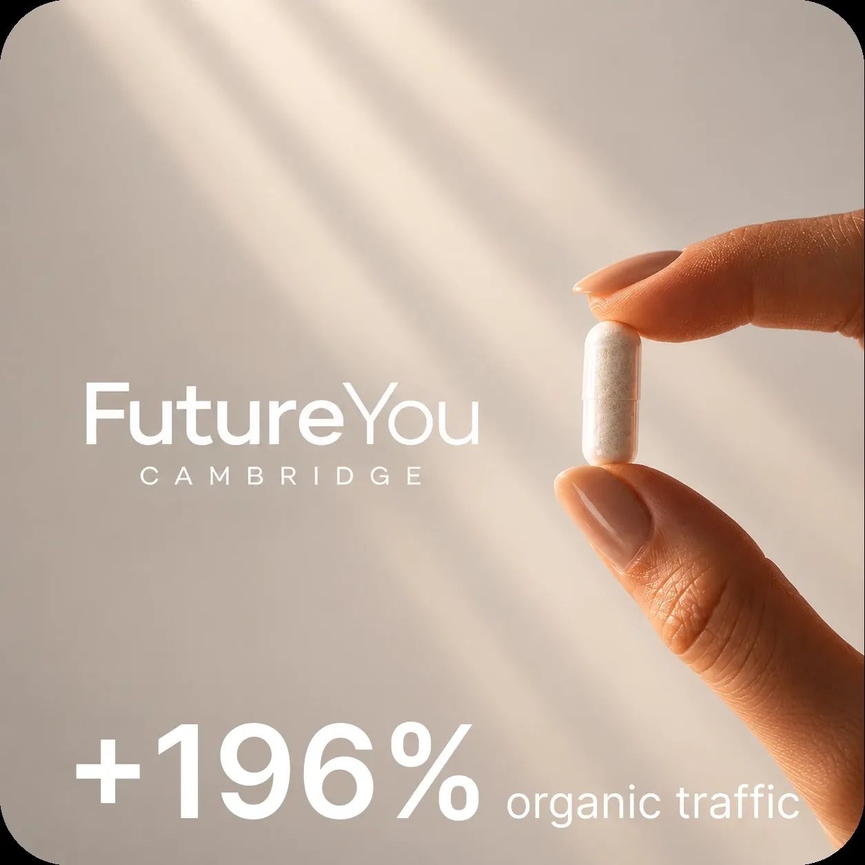 FutureYou Cambridge campaign artwork: a hand holding a supplement capsule in soft light